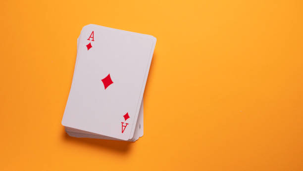 stacked deck of cards with ace of diamonds showing