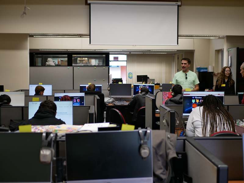 A group of students working in front of their computers at the Tech Lab.