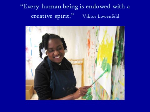 Student smiling while painting a picture, with the quote "Every human being is endowed with a creative spirit" by Viktor Lowenfeld above the picture.